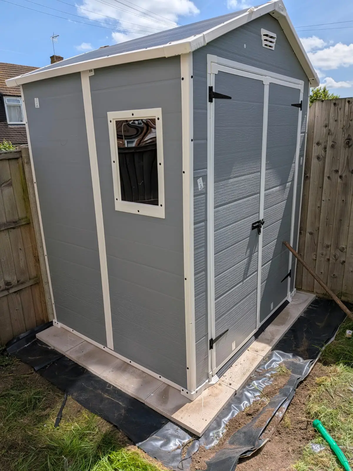 Garden shed built on a levelled slab base laid over a weed membrane